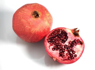POMEGRANATA FRUIT punica granatum AGAINST WHITE BACKGROUND