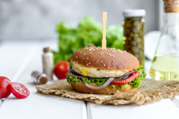 Delicious fresh homemade burger on a wooden table
