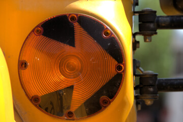 Close up of school bus front left turn signal.