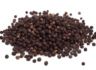 BLACK PEPPERCORN AGAINST WHITE BACKGROUND