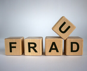 Concept word 'fraud' on cubes on a beautiful white background. Business concept. Copy space.