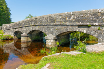 old stone bridge river crossing near postbridge, dartmoor, devon