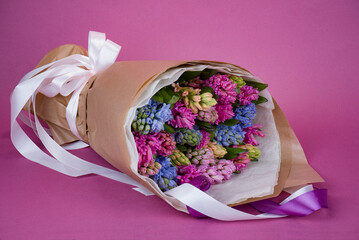 Bouquet of multi-colored hyacinths on a lilac background
