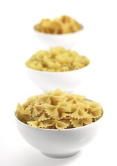 Shells and Twisted Pasta Against White Background