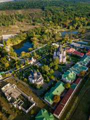 Flight over a christian monastery surrounded by autumn forest. Kurky monastery, Moldova republic of. © Igor Syrbu