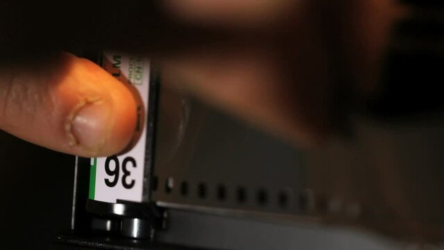 Loading 35mm film into photography still camera