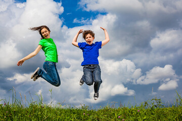 Girl and boy running, jumping outdoor