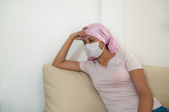 Portrait Of A Beautiful Woman In A Medical Mask Recovering From Chemotherapy - Fighting Cancer