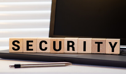 Security word on wooden cube blocks on white grey glossy background