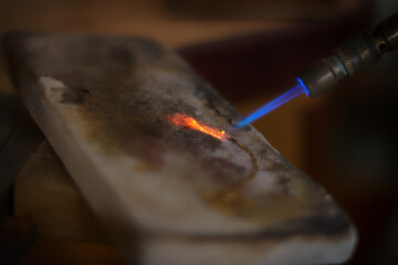 Jeweler welding a gold bracelet. Goldsmith jewelry. Craftsman jeweler working on jewelry. Goldsmith.
Goldsmith workshop jewels and articles of work value