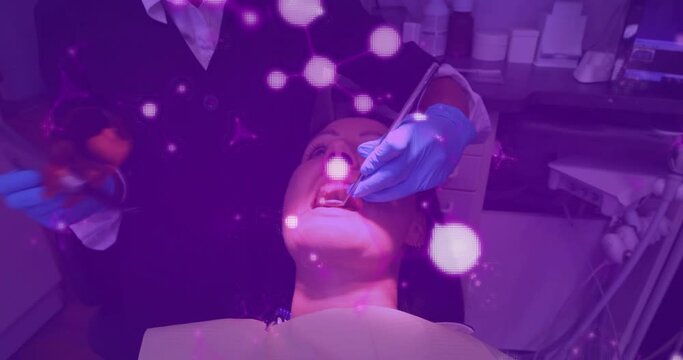 Glowing molecular structures moving against dentist treating female patients