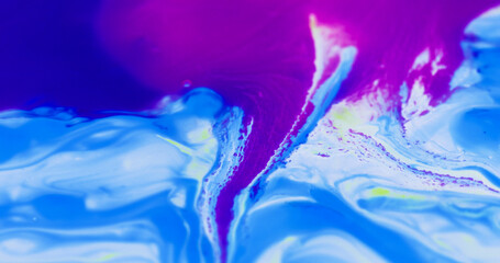 Macro paint creative unique image. Oil mixed dye, paint, macro images, in motion. Print, digital artwork, wallpaper, backgrounds, banners, cards, websites. Neon blue, purple, movement, vibrant