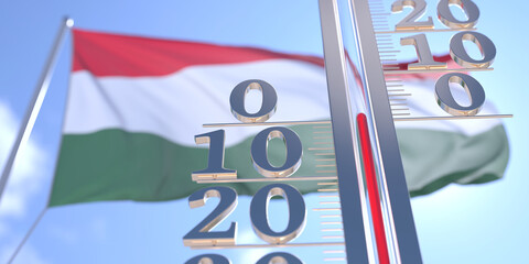 Thermometer shows 0 zero air temperature near waving flag of Hungary. Weather forecast conceptual 3D rendering