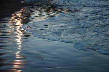 reflection on the water on the seashore