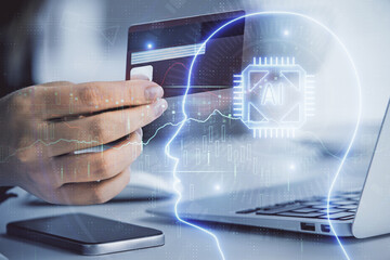 Double exposure of woman on-line shopping holding a credit card and brain hologram drawing. Data E-commerce concept.