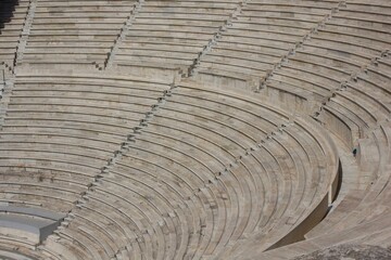 Architectural close up of the stone steps of the Odeon of Herodes Atticus amphiteatre ruin in Athen, Greece