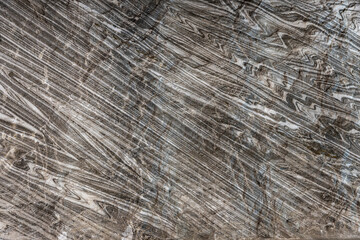 Abstract gray texture of natural, raw salt in an underground salt mine