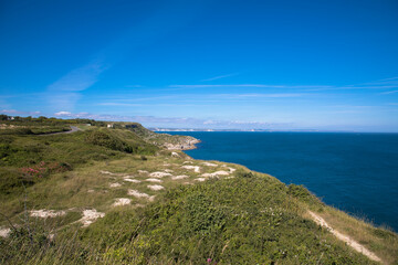 Views of the coast of Isle of Portland with white cliffs of Dorset in the background, Dorset, UK