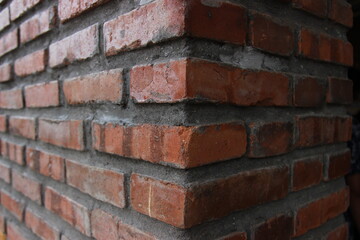 Obraz premium wall texture with red brick and cement arrangement. brick wall patterns for background and design materials