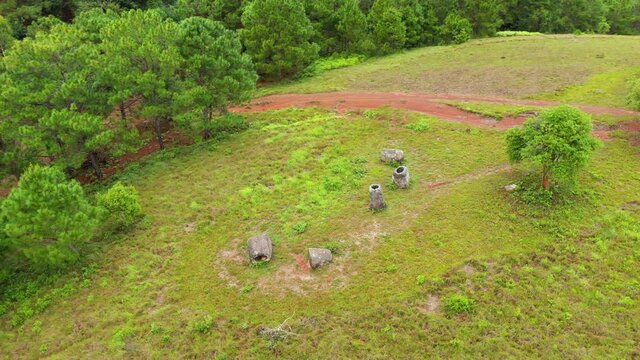 The remains of the Plain of Jars in Asia, Laos, towards Luang Prabang, in summer, on a cloudy day.