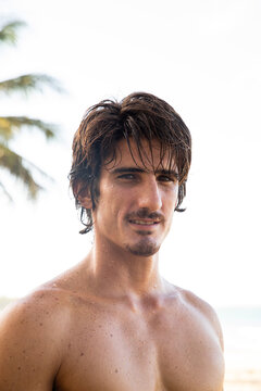 Portraits of surfer at the beach.