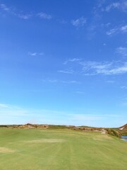 golf course with blue sky