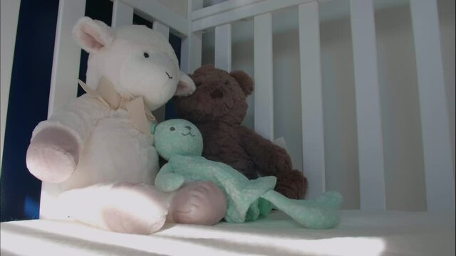 Time-Lapse In Nursery. Sun Crosses By Stuffed Animals And Cradle. Patience, Hope