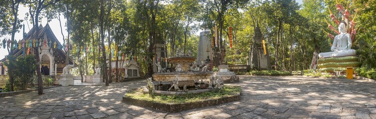 Phayao, Thailand - Dec 8, 2019: Fountain Pool and Thai Church and Buddha Statue in Analayo Temple or Wat Analayo at Phayao Thailand