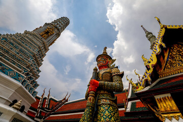 Giant Yaksha guarding the Temple of the Emerald Buddha or Wat Phra Kaew at the Grand Palace in Thailand