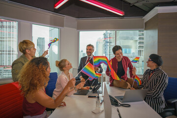 diverse business people with LGBTQ have rainbow flag on hand