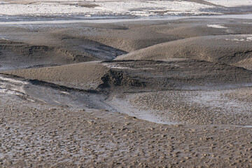 Fototapeta na wymiar The sea water exiting the tidal flat.
