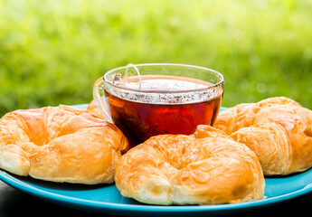 A cup of tea with croissants  , out door Chiangmai Thailand