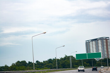 Fototapeta na wymiar blank sign on the road, traffic on the road