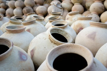 Fototapeta na wymiar Handmade clay pots in rows