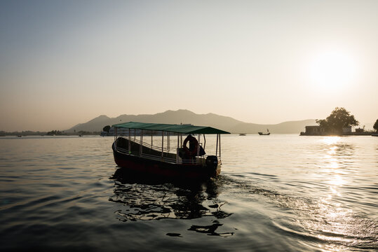 Boat On Lake Pichola At Sunset In Udaiur, India