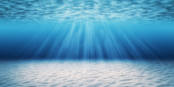 Abstract Image Of Tropical Sand Beach On The Bottom Of Underwater Blue Deep Ocean Wide Nature Background With Rays Of Sunlight.