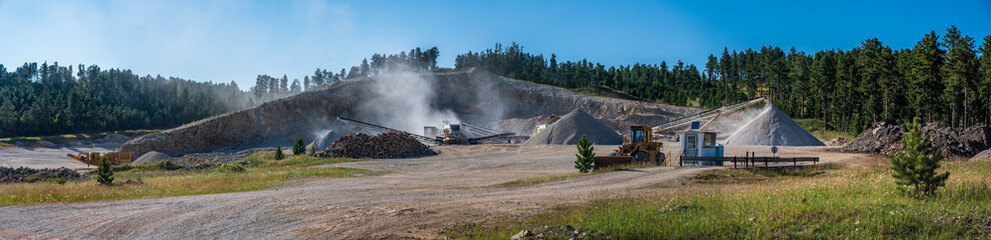 Fototapeta premium Open pit sand and gravel quarry with heavy equipment