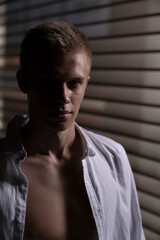 portrait of a blond, athletic guy who just turned eighteen