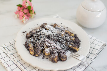 Potato dumplings sulance gnocci with milled poppy seeds and sugar powder