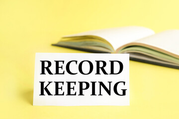 record keeping. text on white paper on yellow background