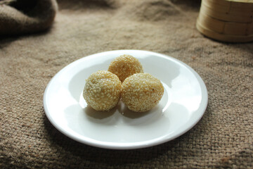 Onde-onde is made from fried flour or glutinous rice flour and the surface is coated with sesame seeds. Onde-onde is a popular street food in Indonesia
