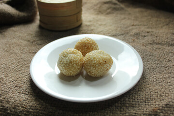 Onde-onde is made from fried flour or glutinous rice flour and the surface is coated with sesame seeds. Onde-onde is a popular street food in Indonesia