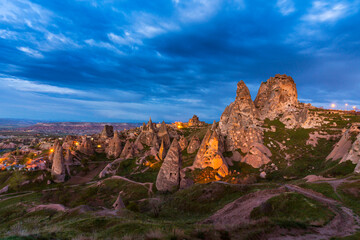 Limestone rock formations under dramatic storm clouds, in Cappadocia, Turkey