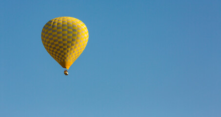 Hot air balloons profiled on clear blue sky, in Cappadocia, Turkey