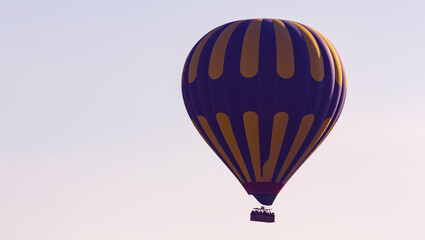 Obraz premium Hot air balloons profiled on clear blue sky, in Cappadocia, Turkey