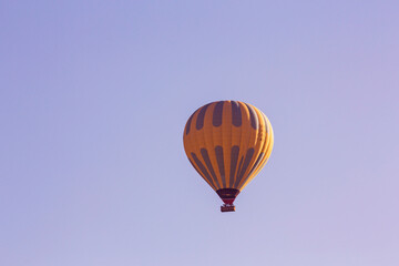 Hot air balloons profiled on clear blue sky, in Cappadocia, Turkey