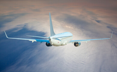White passenger airplane in the clouds  - Travel by air transport