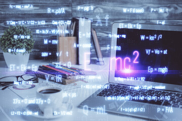 Desktop computer background and formula hologram writing. Double exposure. Education concept.