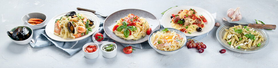 Plates of pastas with different kinds of sauces.