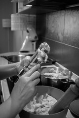 Dough in a blue bowl made for traditional food tulumbas in a kitchen AM